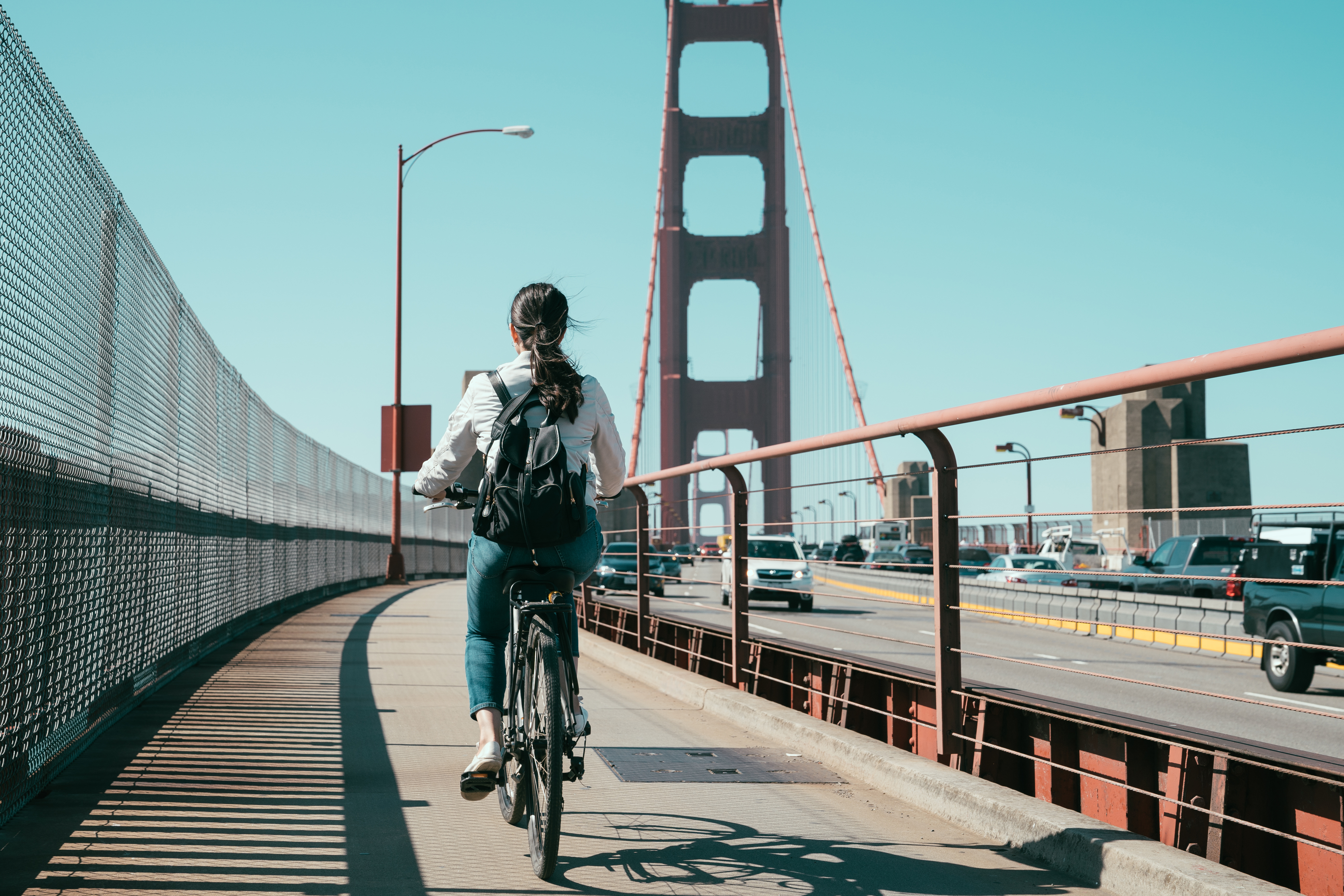 Person riding a bike on golden gate bridge