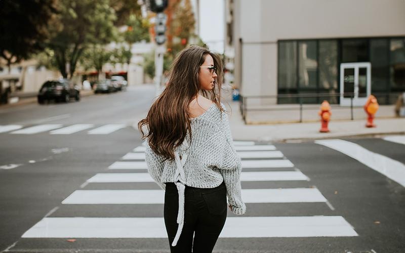 a person walking across a crosswalk